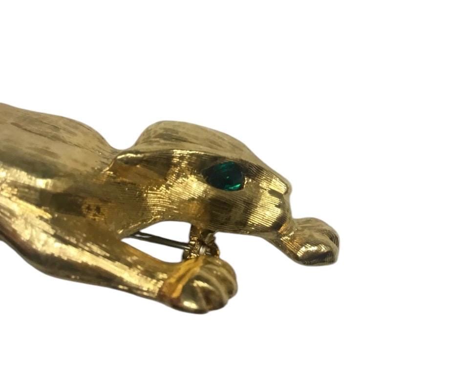 Fancy & Unusual Vintage 1970s leopard brooch with Green rhinestone eyes