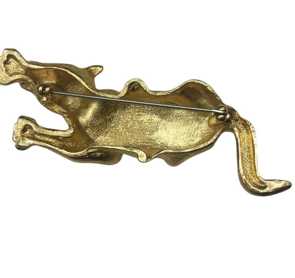 Fancy & Unusual Vintage 1970s leopard brooch with Green rhinestone eyes