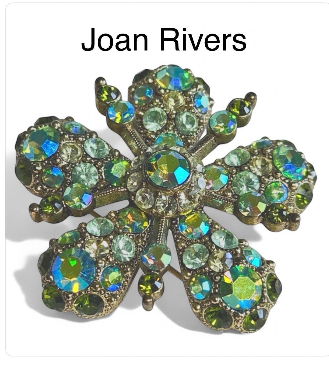 Joan Rivers Star Burst Brooch: Elegant Gold-Toned Accessory with Opalescent Green Crystals