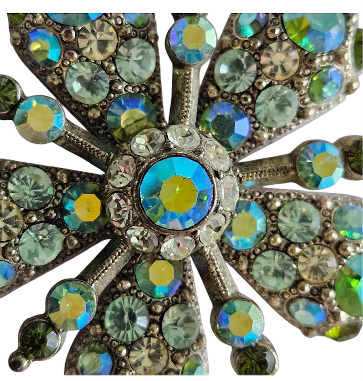 Joan Rivers Star Burst Brooch: Elegant Gold-Toned Accessory with Opalescent Green Crystals